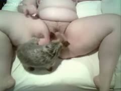 Her wet pussy is licked by her pet dog.